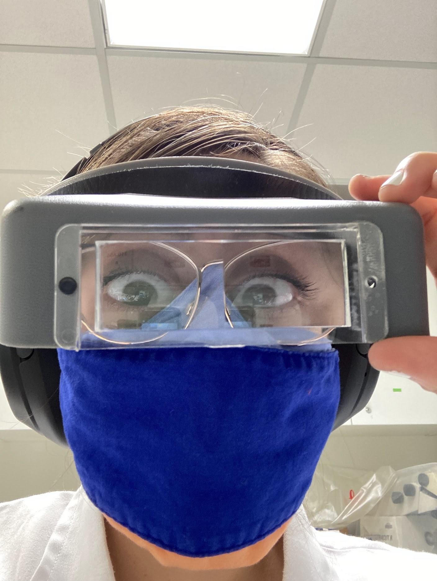 Karmi in lab goggles during the PhD years